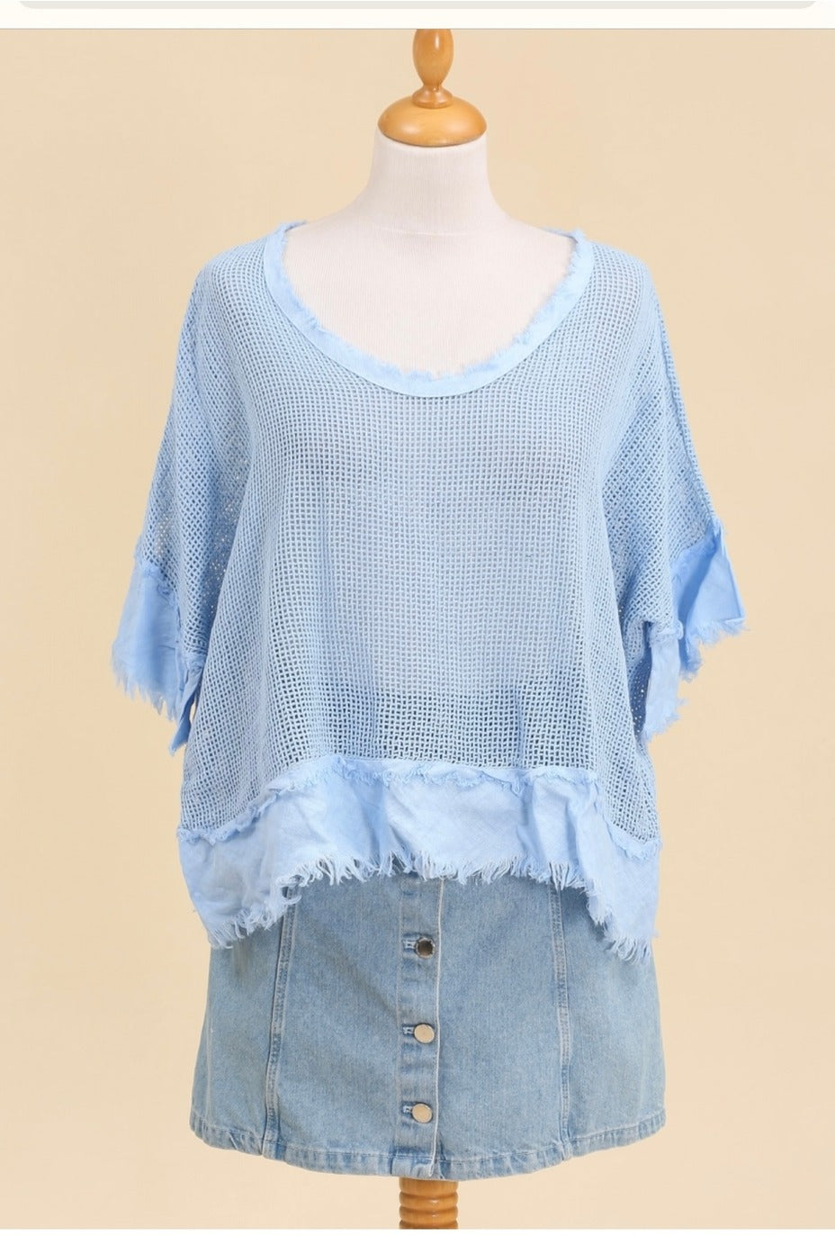 Effortless summer outfit with ilight blue boho knit top styled with linen shorts and sandals