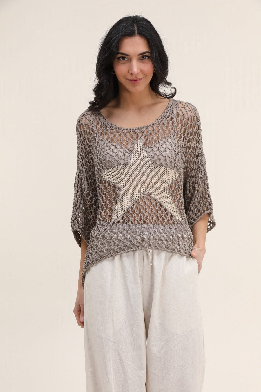 Effortless spring outfit featuring white star-patterned cotton sweater paired with jeans