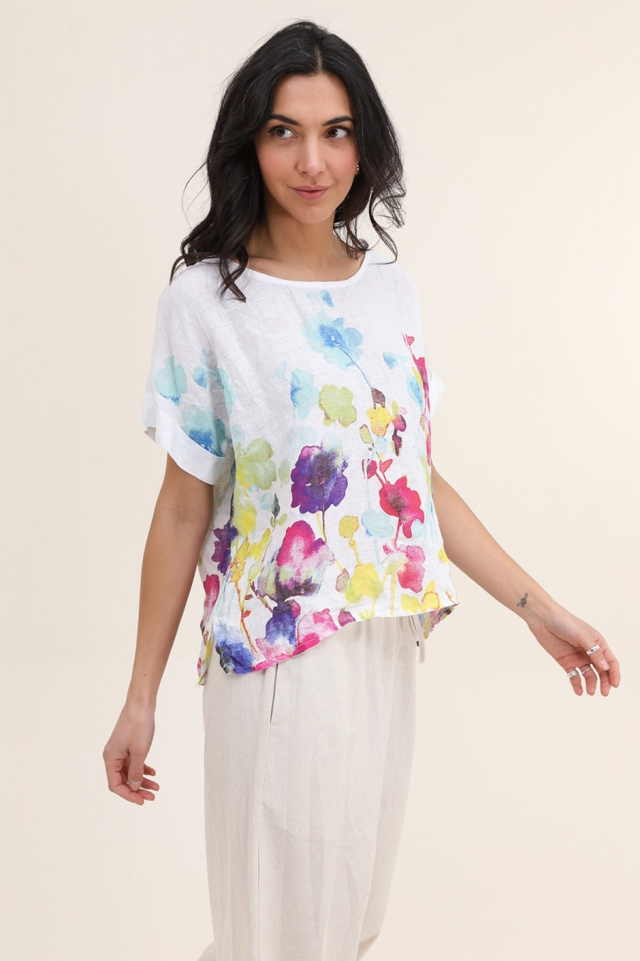 white Italian linen blouse featuring delicate floral print, short sleeves, and relaxed fit