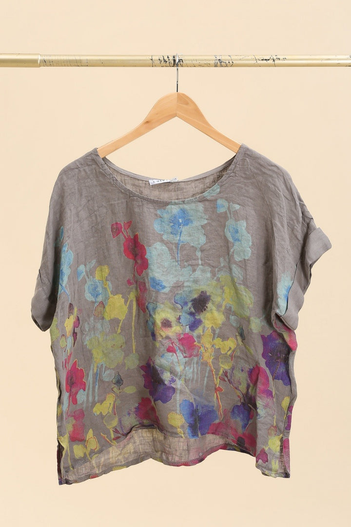 begie Italian linen blouse featuring delicate floral print, short sleeves, and relaxed fit.