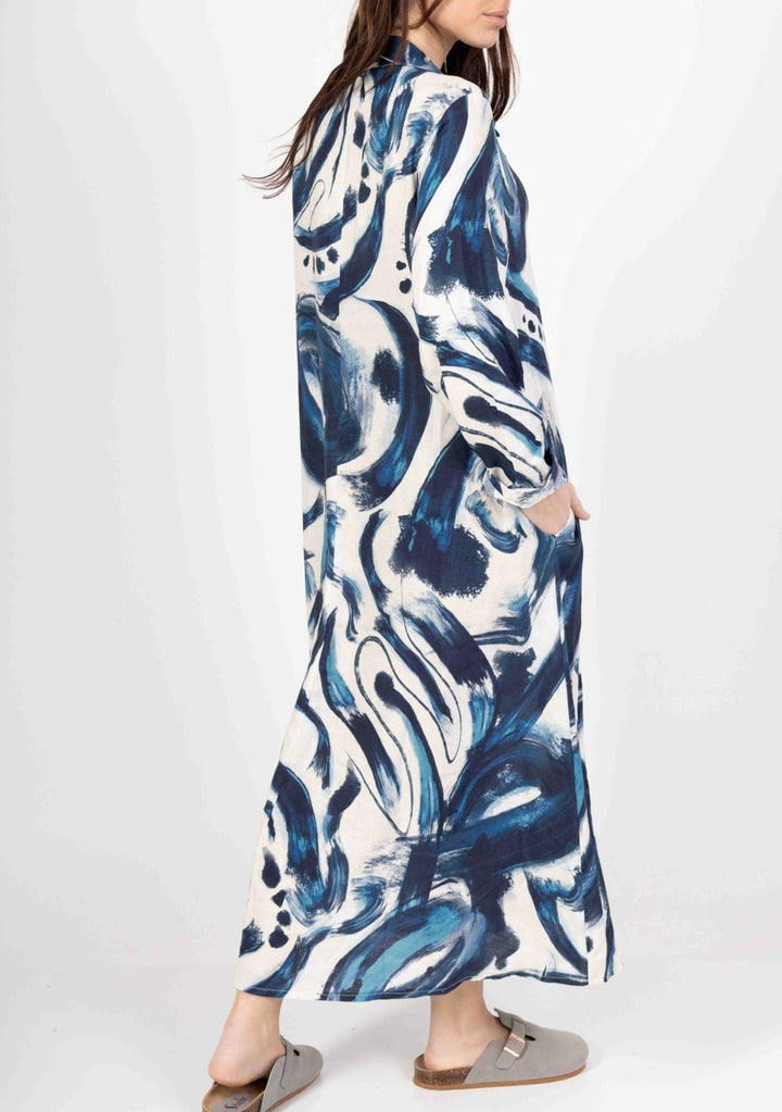 Back view of Italian-made natural linen dress featuring relaxed fit and minimalist design