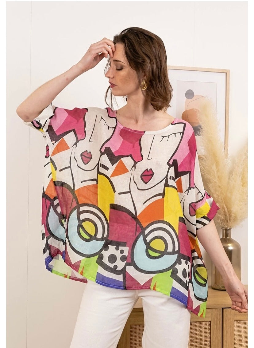 Side view of women's pink linen top showcasing artistic Picasso print and breezy silhouette