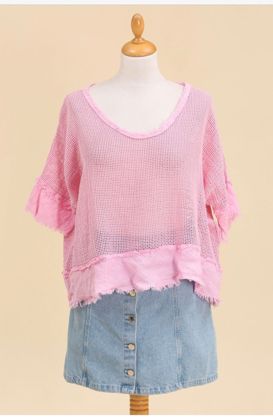 Effortless summer outfit with pink boho knit top styled with linen shorts and sandals