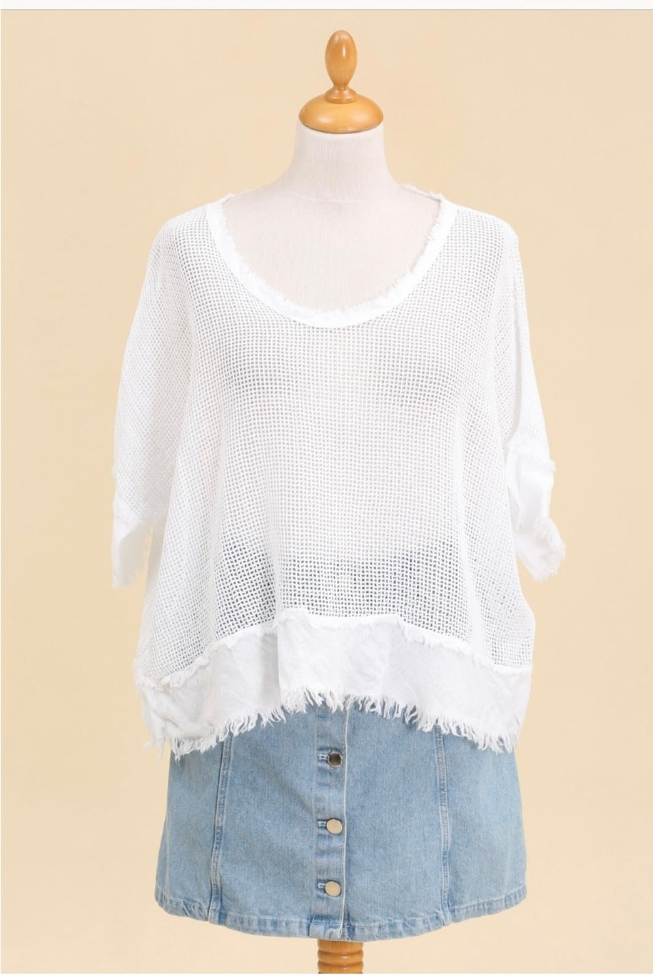 Effortless summer outfit with white boho knit top styled with linen shorts and sandals