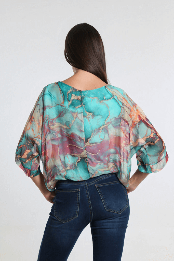 Back view of Italian-made Tiffany blue silk blouse featuring elegant marble design and relaxed fit