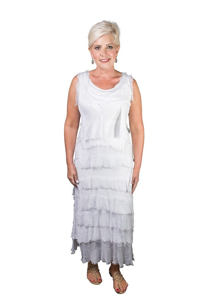 White silk maxi dress featuring scoop neckline, tiered ruffles, and flowing elegant fit