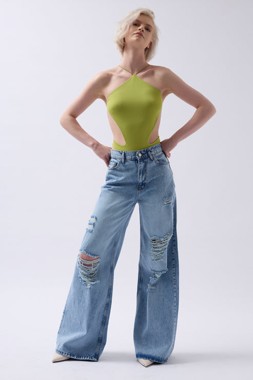 women wears back detail bodysuit in lime color