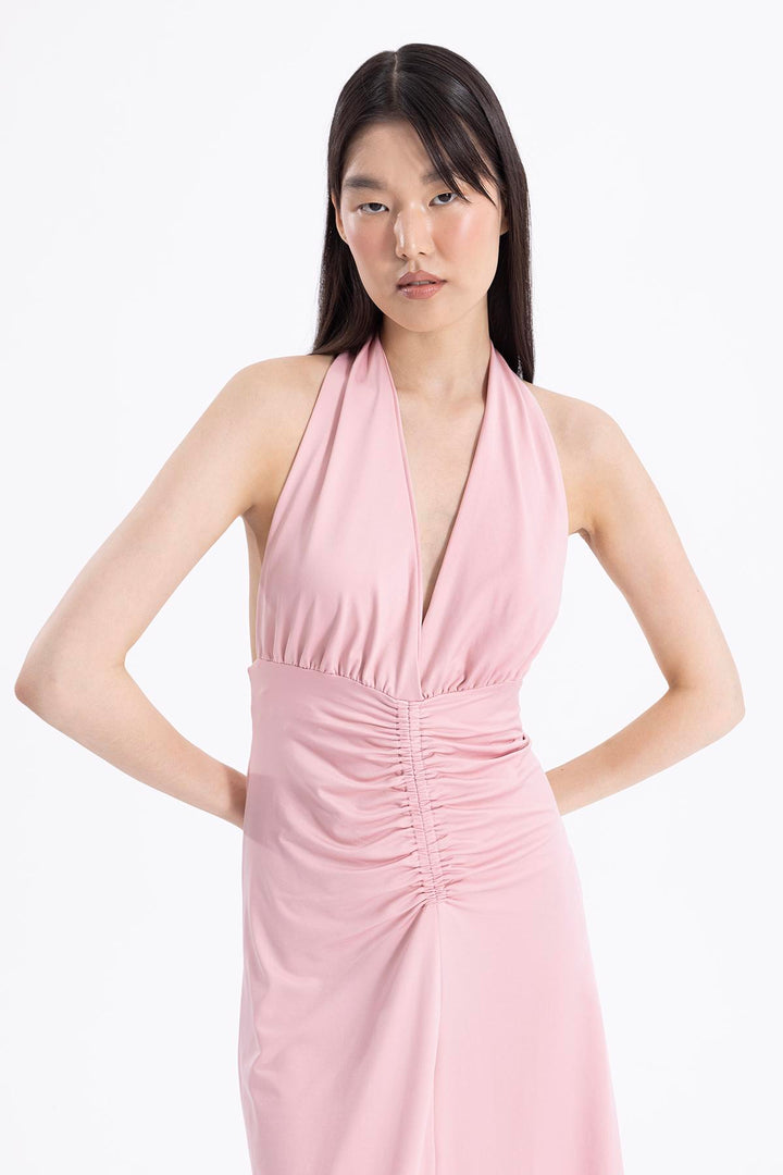 Close-up of light pink draped fabric made from polyamide blend, showcasing smooth soft texture