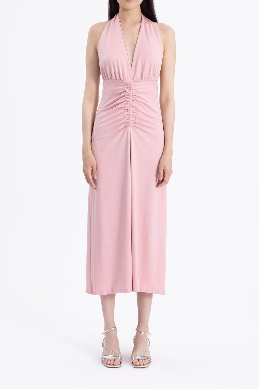 Close-up of light pink draped fabric made from polyamide blend, showcasing smooth soft texture