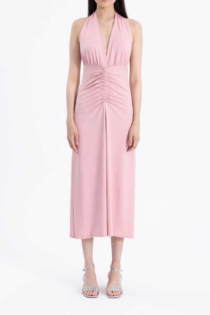 Close-up of light pink draped fabric made from polyamide blend, showcasing smooth soft texture