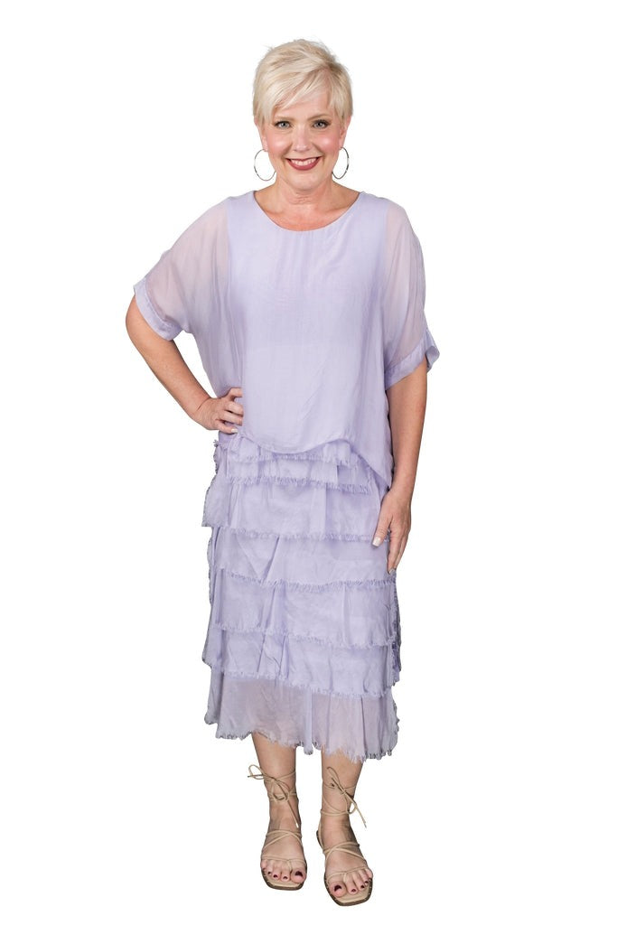 Lilac silk dress featuring scoop neckline, tiered ruffles, and relaxed fit – made in Italy