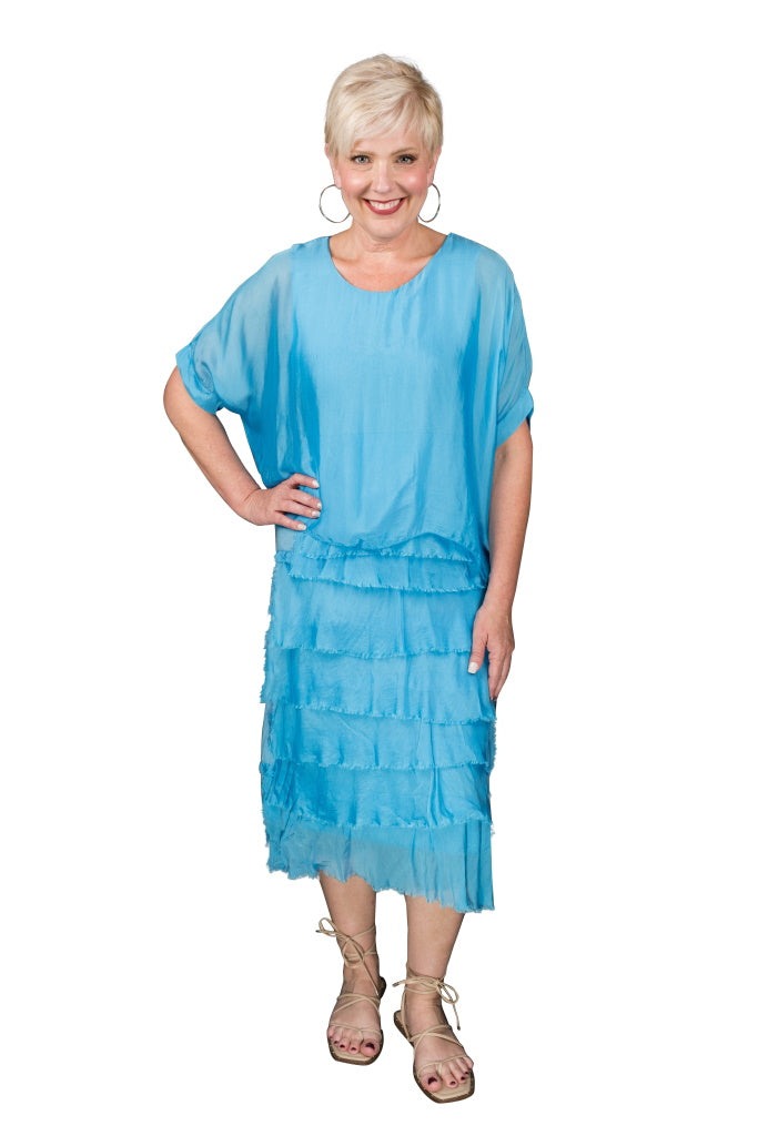 Turquoise silk dress featuring scoop neckline, tiered ruffles, and relaxed silhouette – made in Italy
