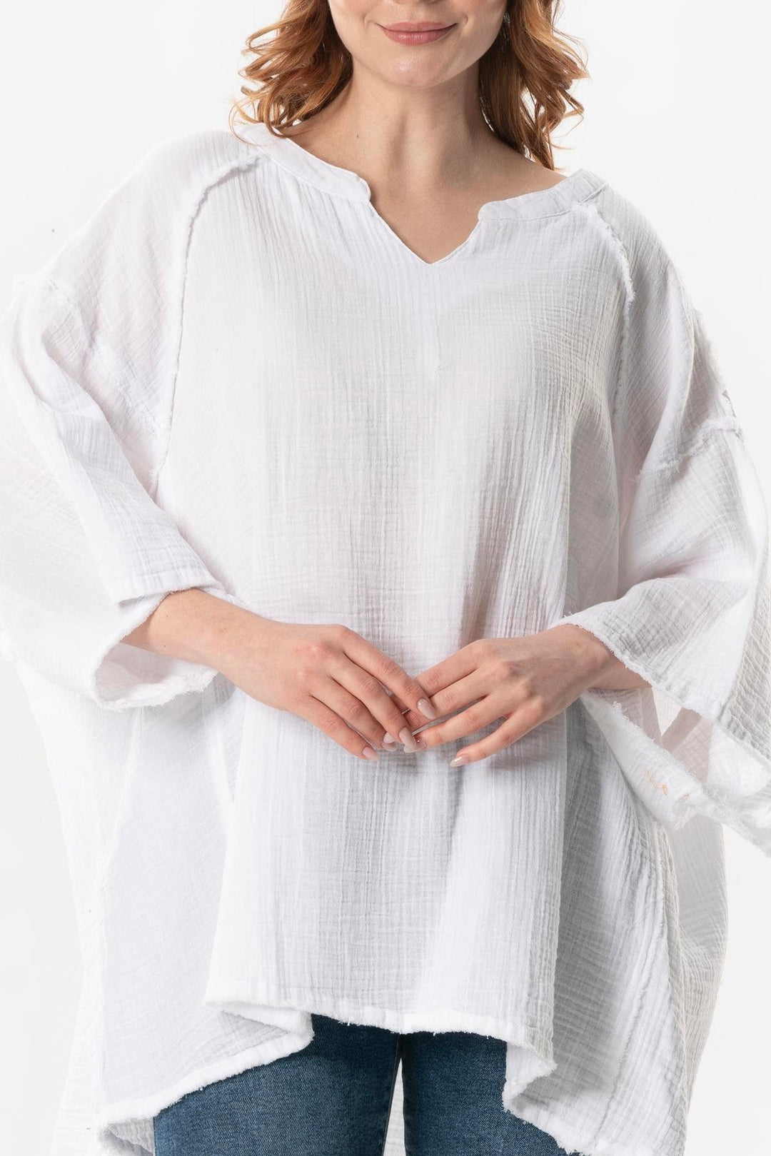 Close-up of soft white gauze cotton fabric showing breathable weave and natural texture