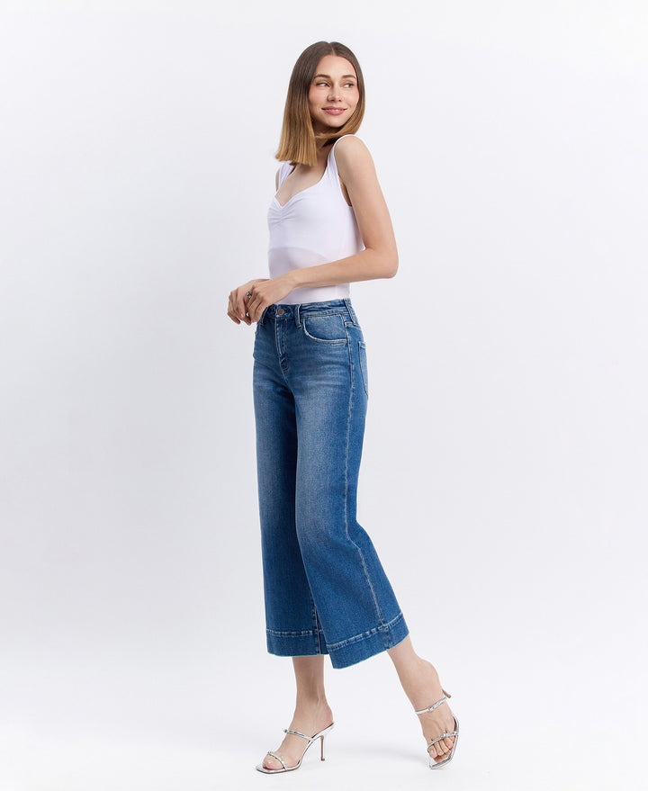 another Side view of high-rise wide-leg cropped jeans featuring relaxed fit and slightly frayed hem