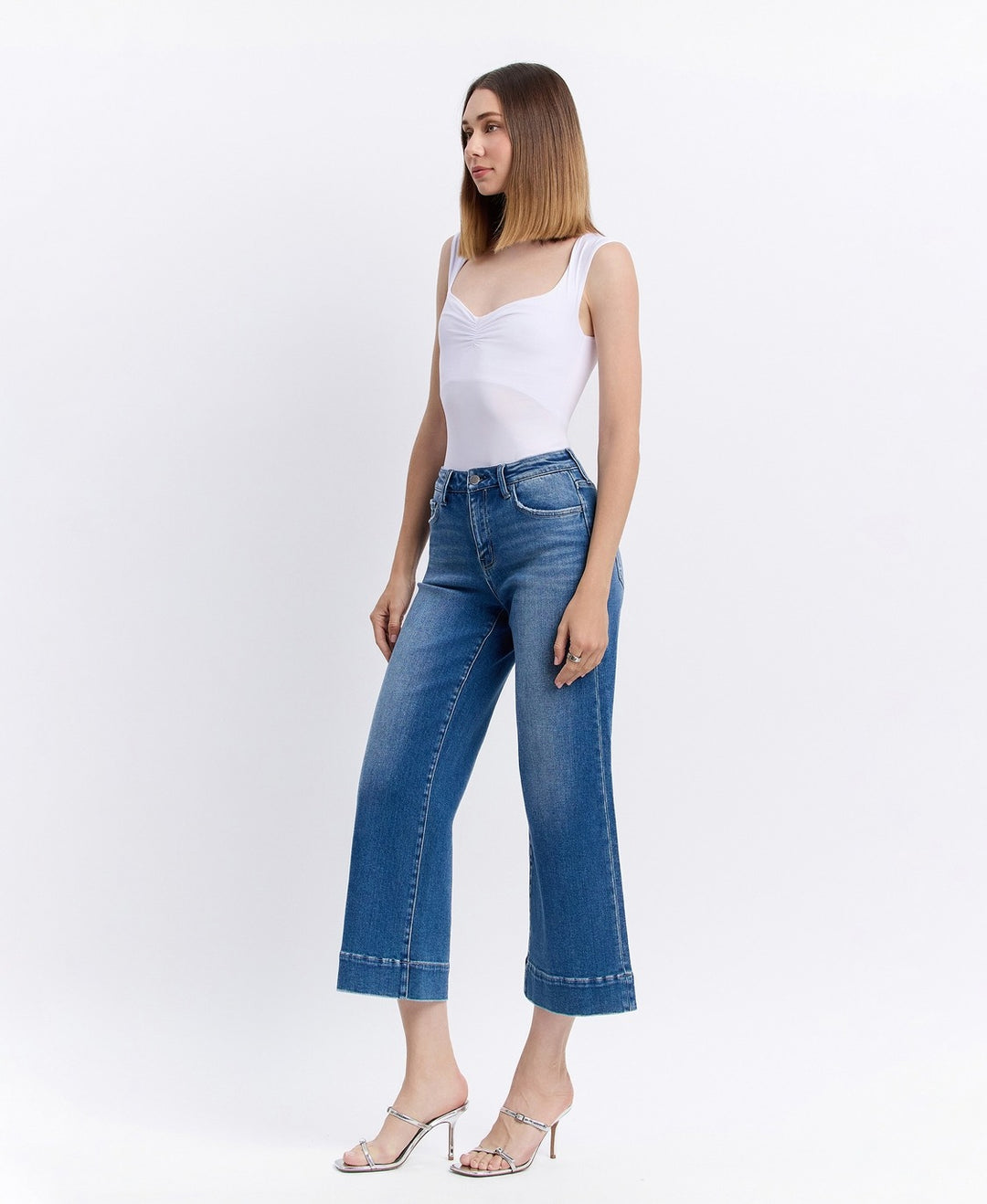 right Side view of high-rise wide-leg cropped jeans featuring relaxed fit and slightly frayed hem