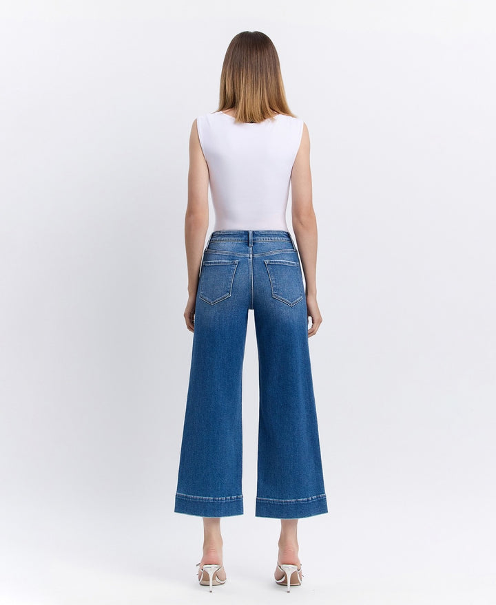 Back view of light blue crop wide-leg jeans with classic back pockets and comfortable rise