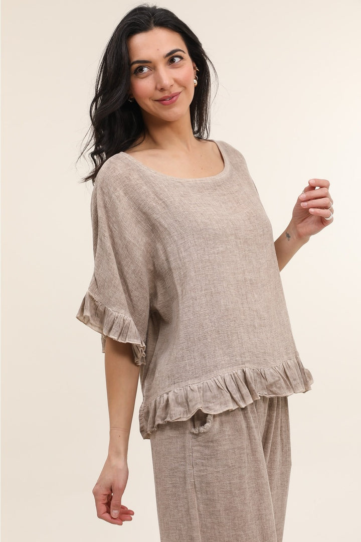 Side view of women's tan Italian linen blouse with relaxed silhouette and eco-friendly fabric