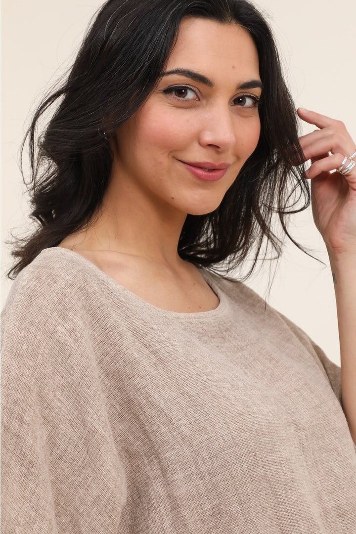 Close-up of 50% linen and 50% cotton blend fabric in tan, showcasing lightweight texture