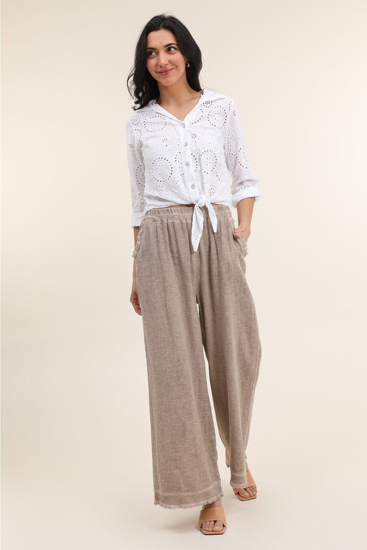 Tan Italian linen pants featuring relaxed fit and breathable fabric