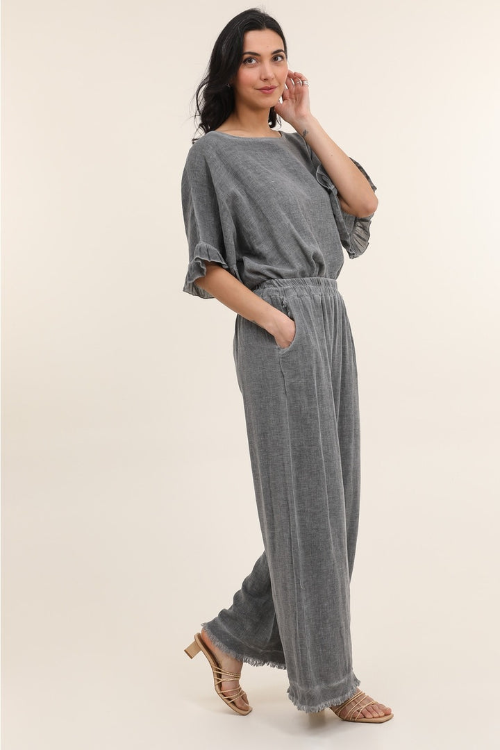 Side view of gray Italian linen pants with relaxed silhouette and eco-friendly fabric