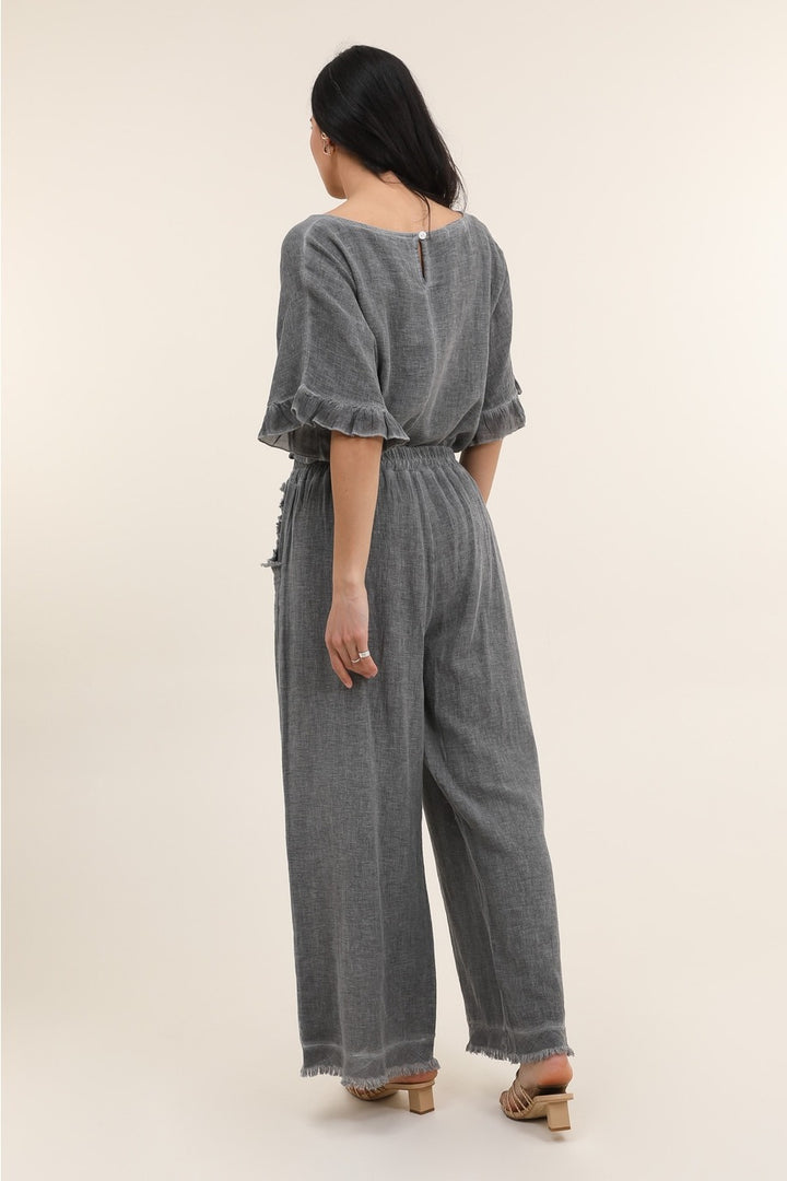 Back view of gray Italian linen pants featuring breathable fabric and timeless design