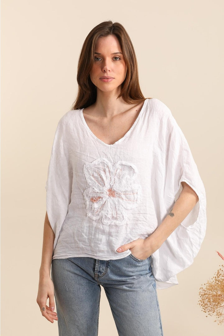 White Italian linen blouse featuring delicate floral embroidery and relaxed fit – made in Italy