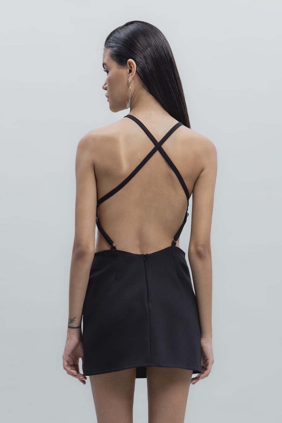 Back view of black mini dress featuring bold criss-cross strap design and open back detail