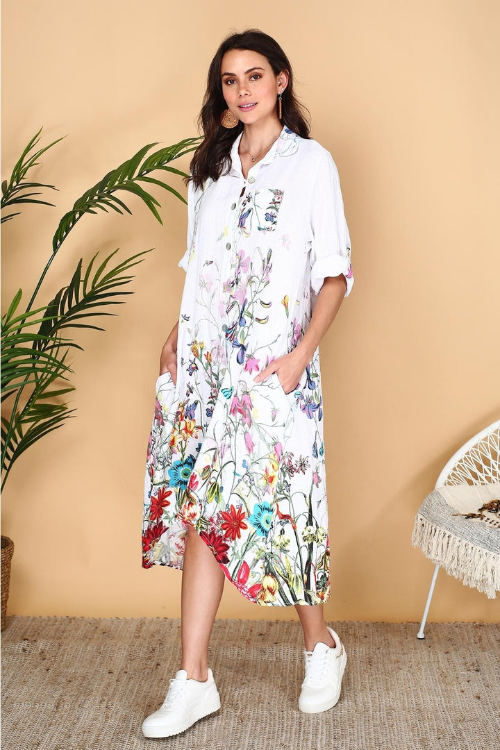 White linen shirt dress with delicate floral print, button-down front, and relaxed fit – made in Italy