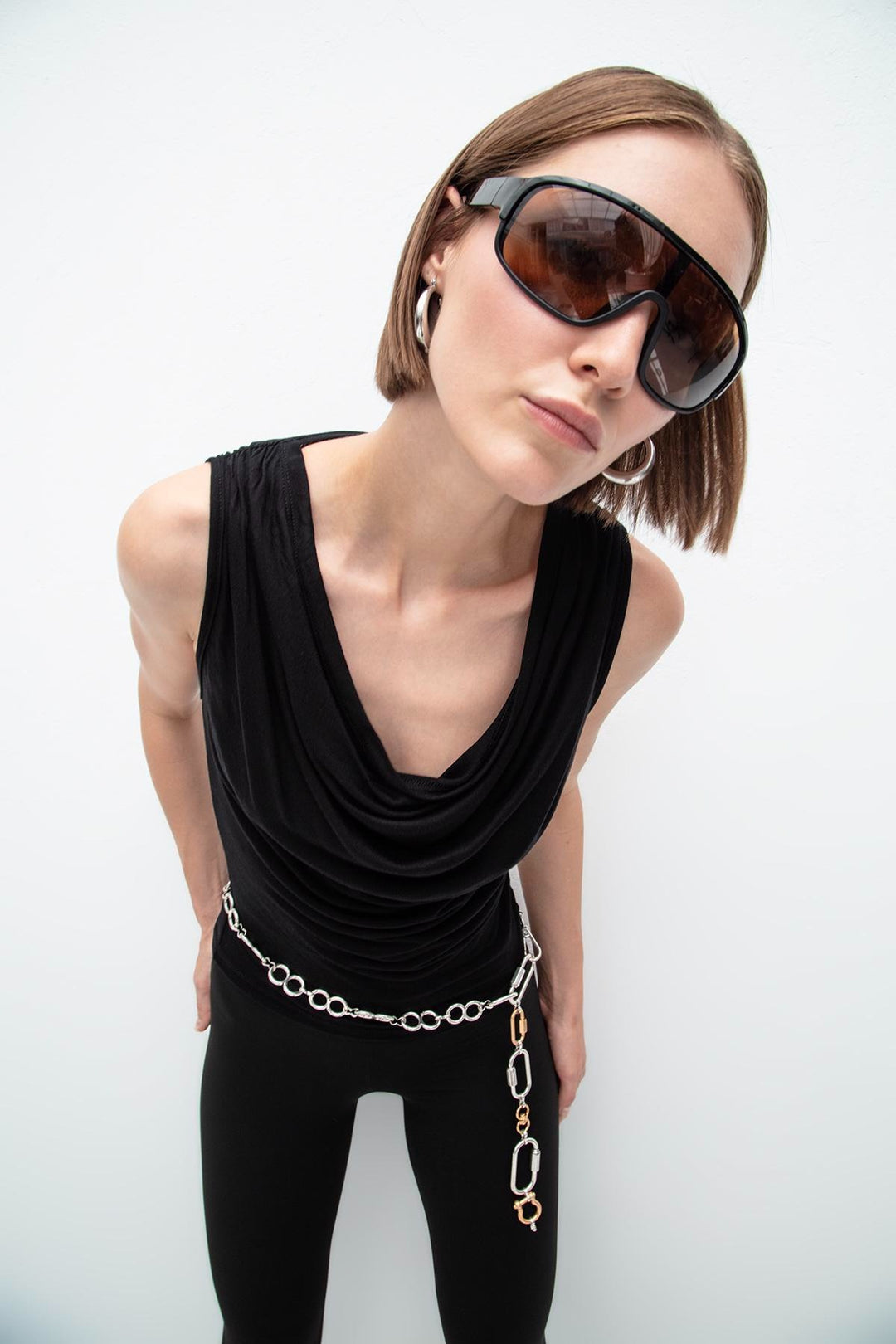 Black sleeveless top featuring elegant ruffle collar and relaxed fit – made in Türkiye