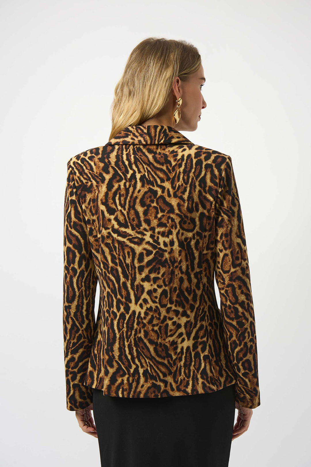 Person wearing a leopard print jacket on a white background
