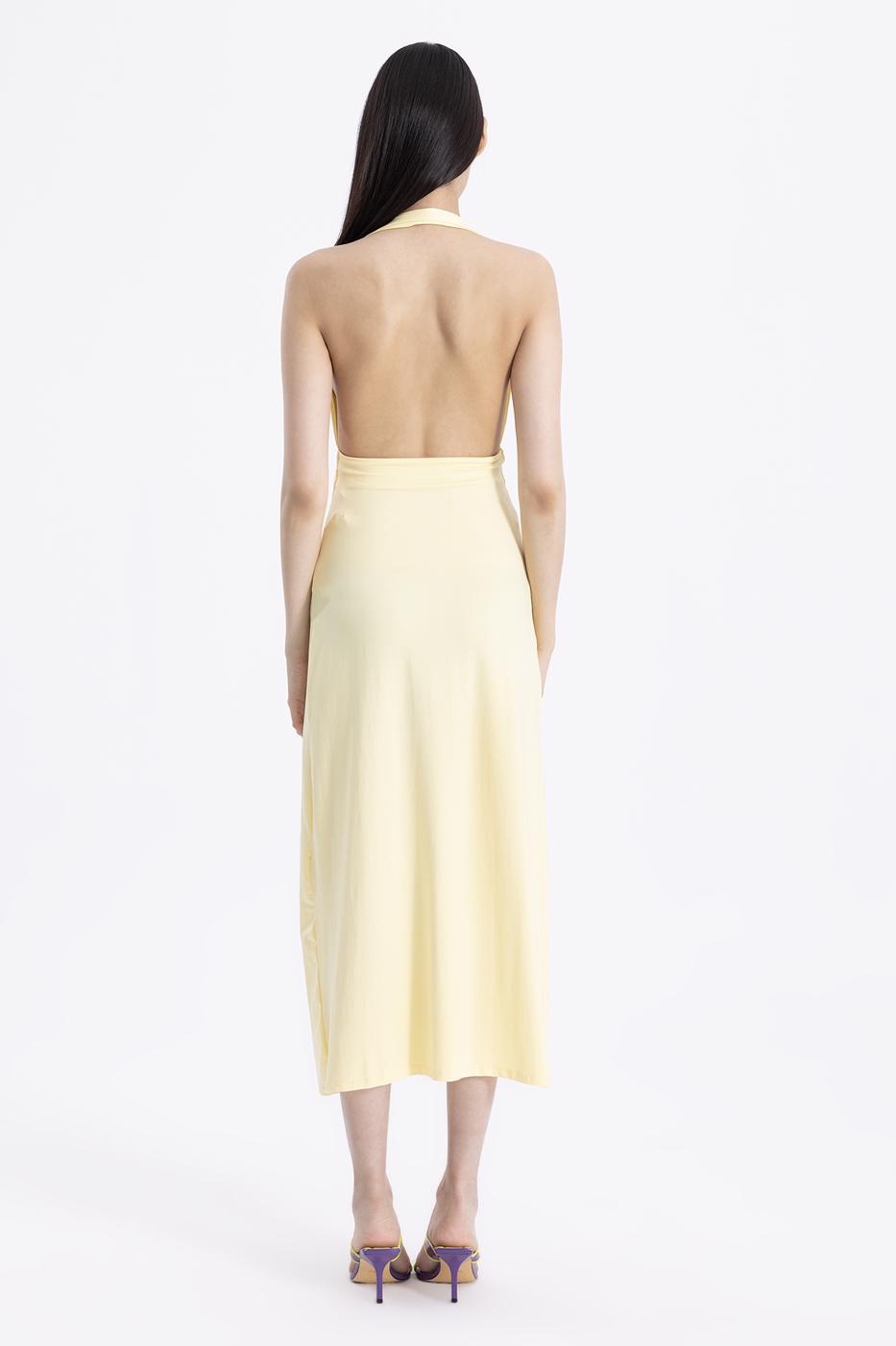 Back view of butter yellow draped midi dress featuring flowing silhouette and sleeveless cut