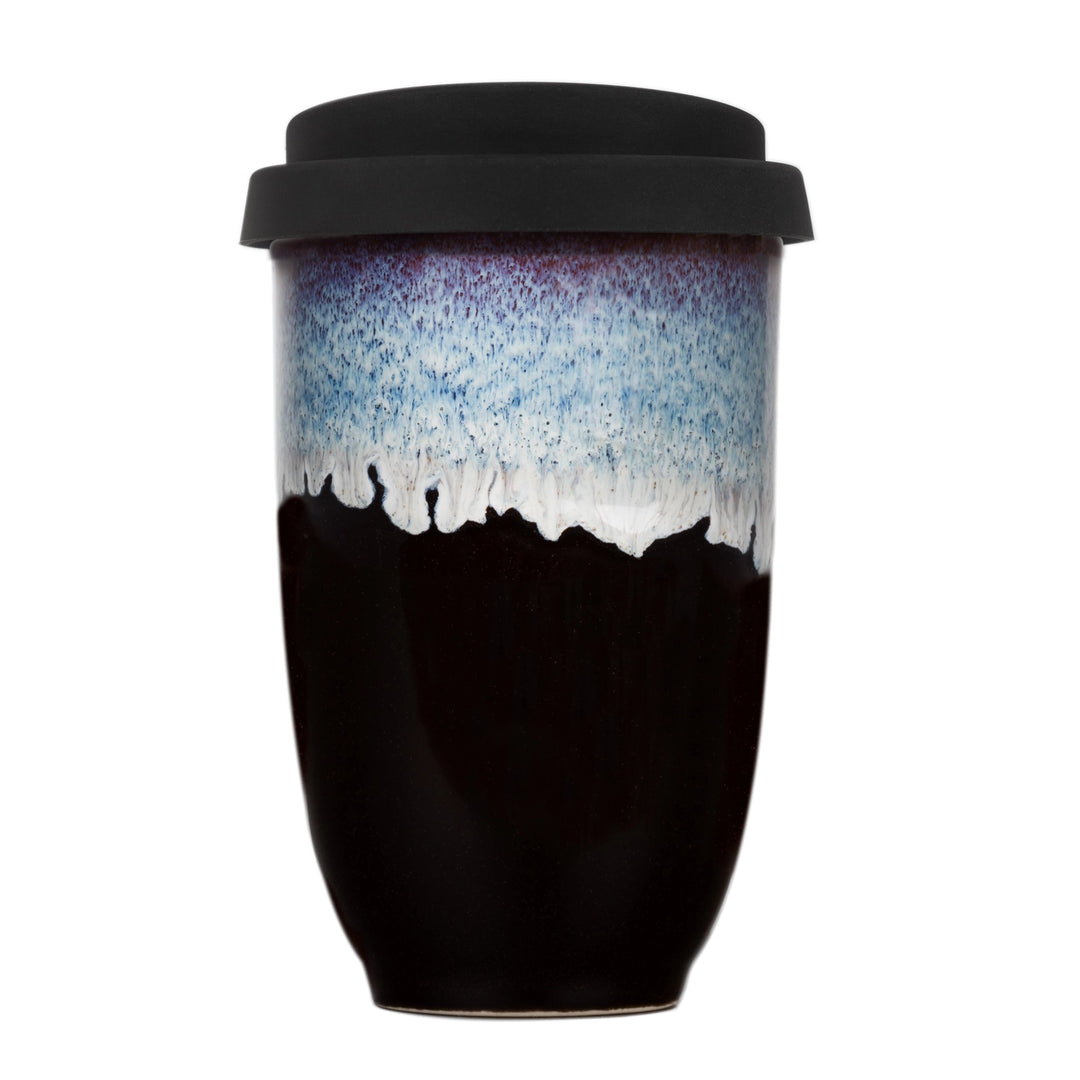 Black ceramic tumbler with gradient design on a white background