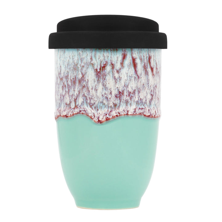 Turquoise ceramic travel mug with black lid on a white background