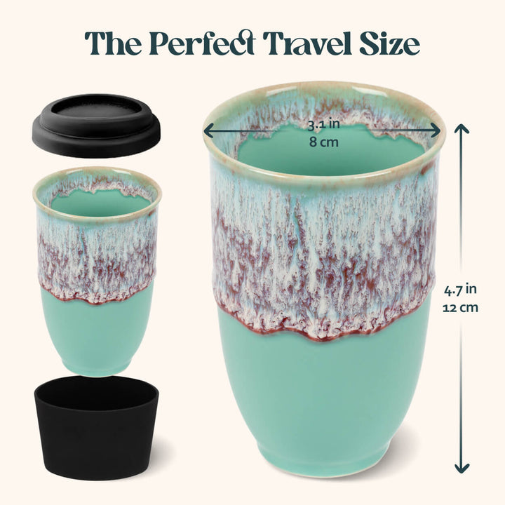 Turquoise ceramic travel mug with black lid and measurements on a white background