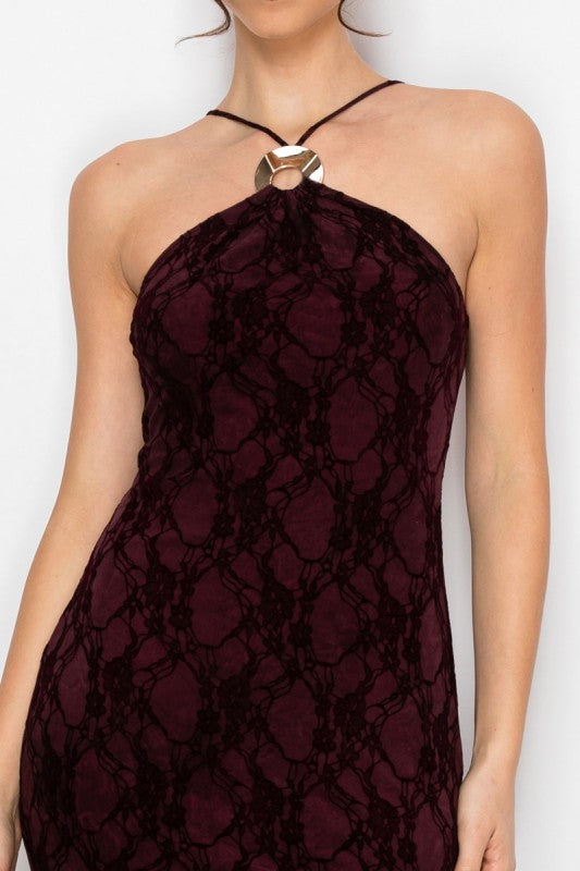 Maroon lace halter neck dress on a plain background
