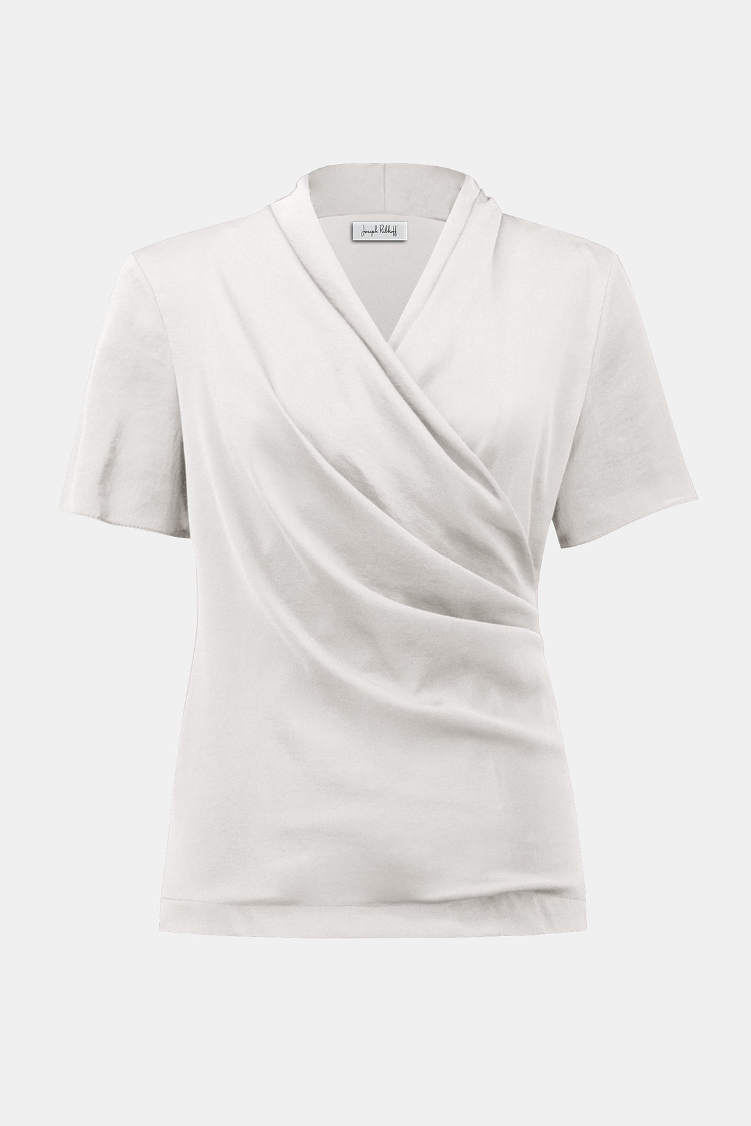 White wrap-style top on a light gray background