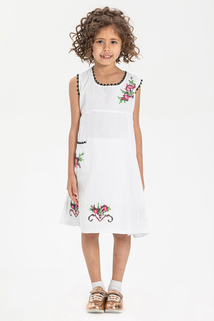 white embroidered sleeveless girls dress