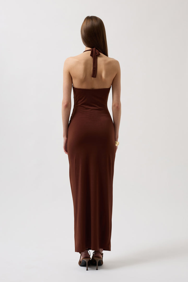 Back view of sleeveless mocha mousse dress with V-back and flowing hemline