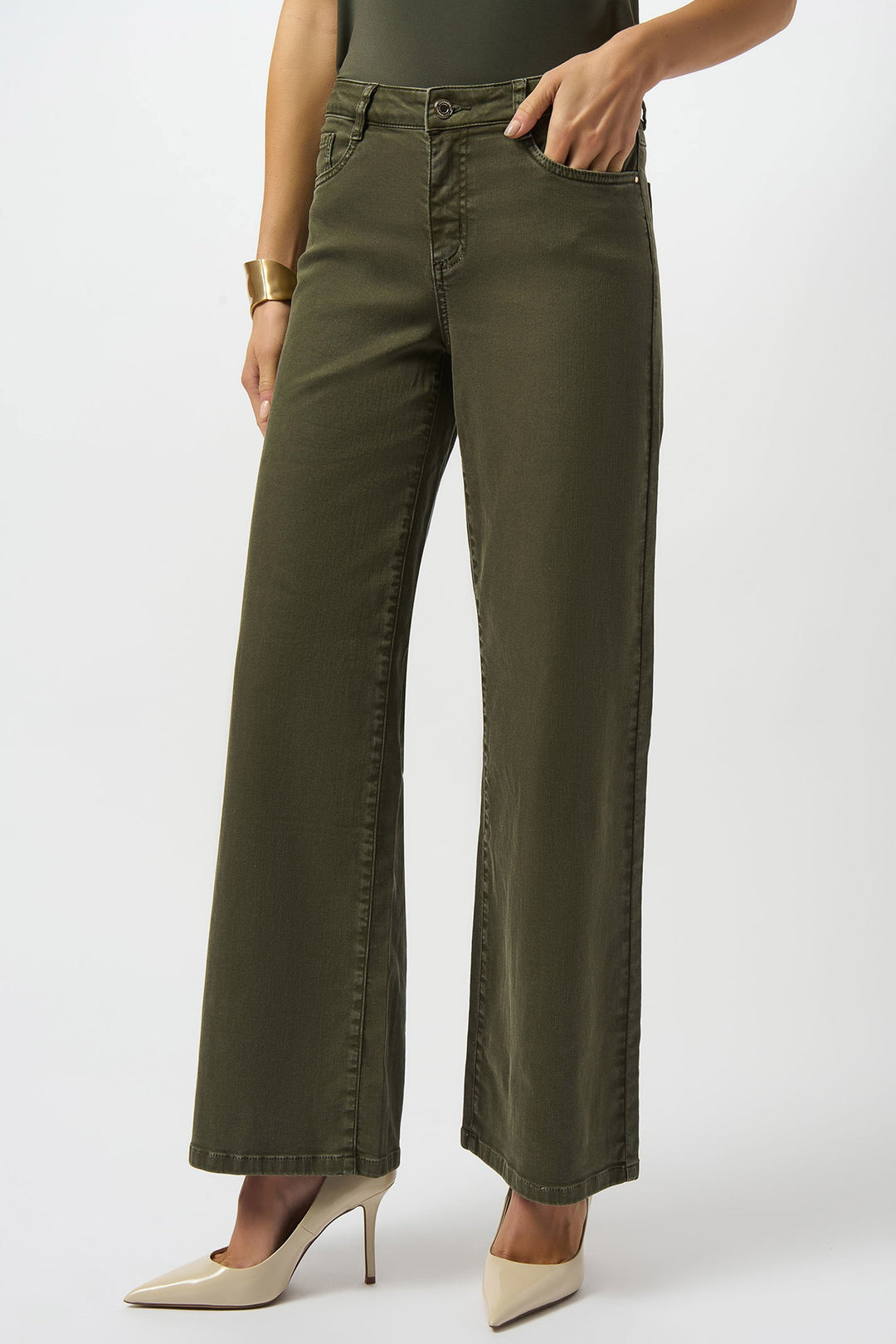 Person wearing olive green wide-leg pants on a white background