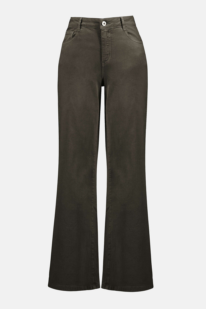 Dark green flared jeans on a light gray background