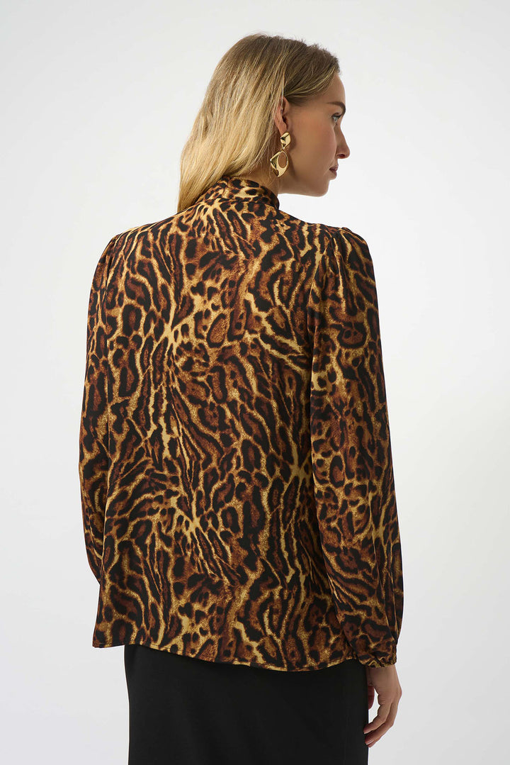 Person wearing a leopard print jacket on a white background