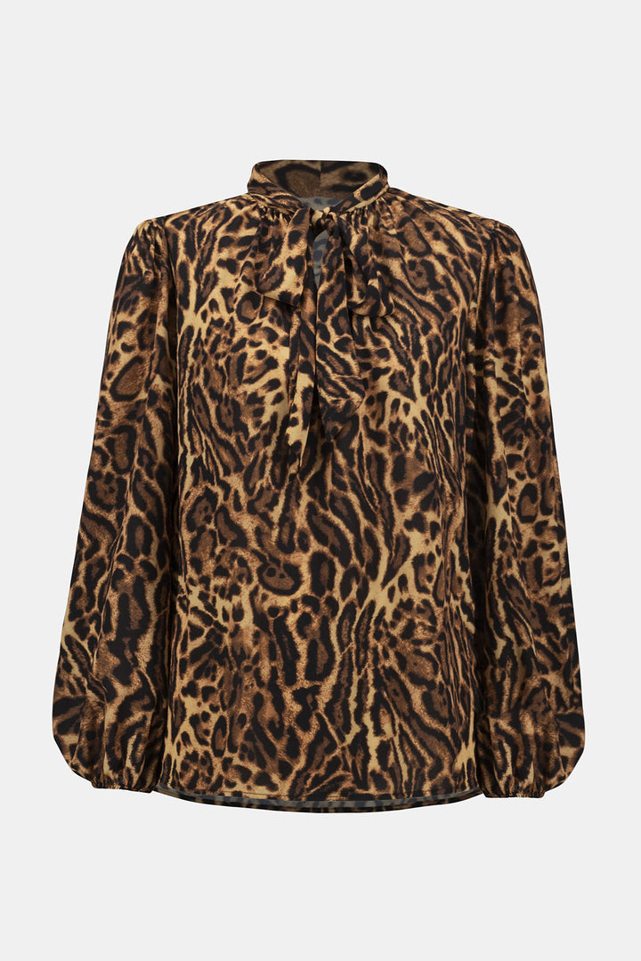 Leopard print blouse on a light gray background