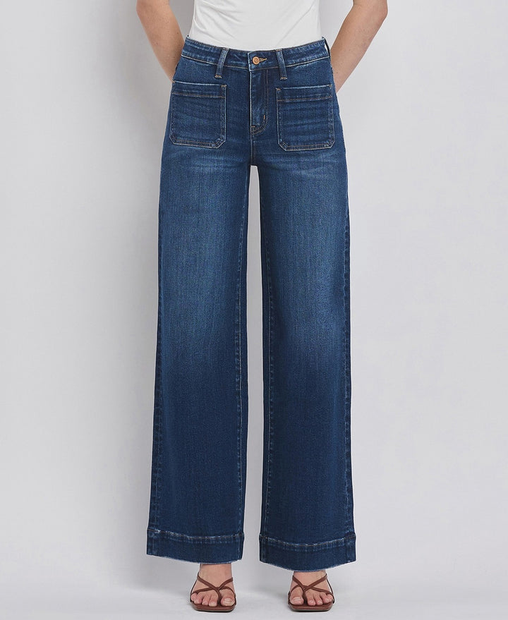 Wide-leg jeans worn by a person on a light gray background