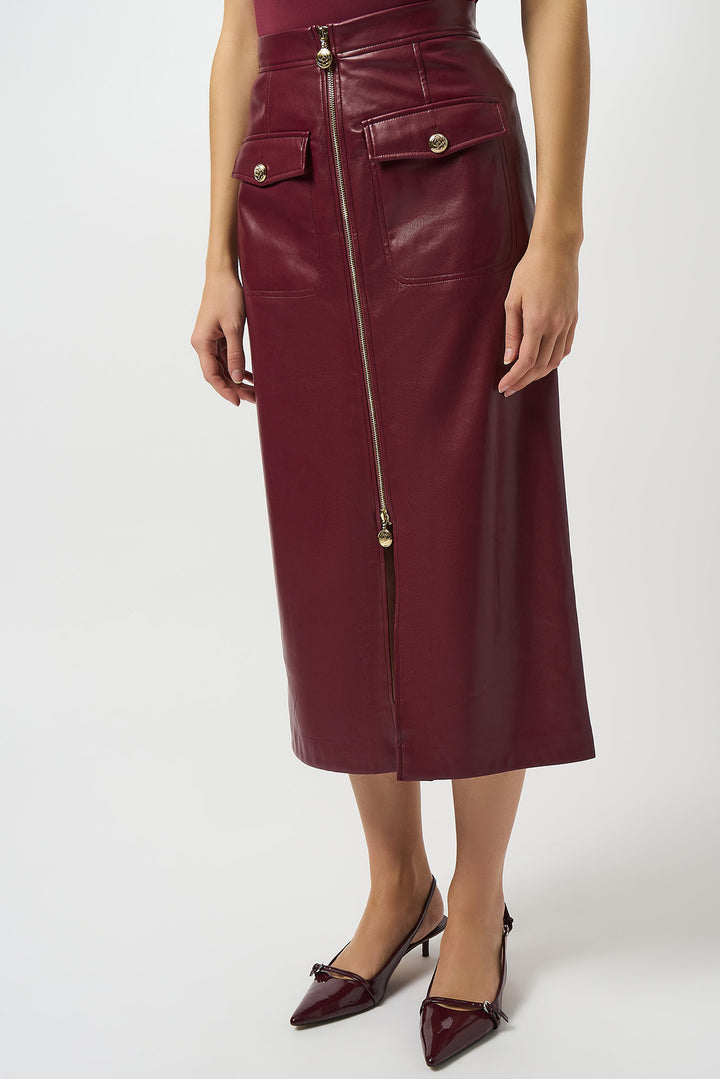 Maroon leather skirt with gold zipper on a white background