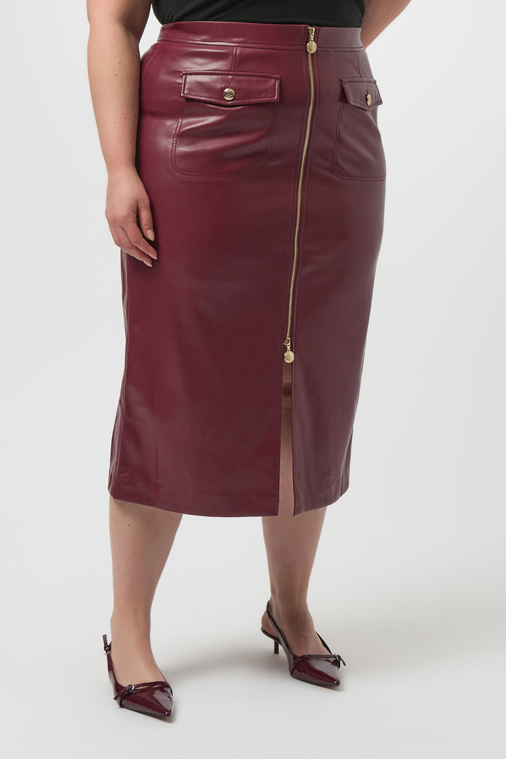Maroon leather skirt with gold zipper on a white background