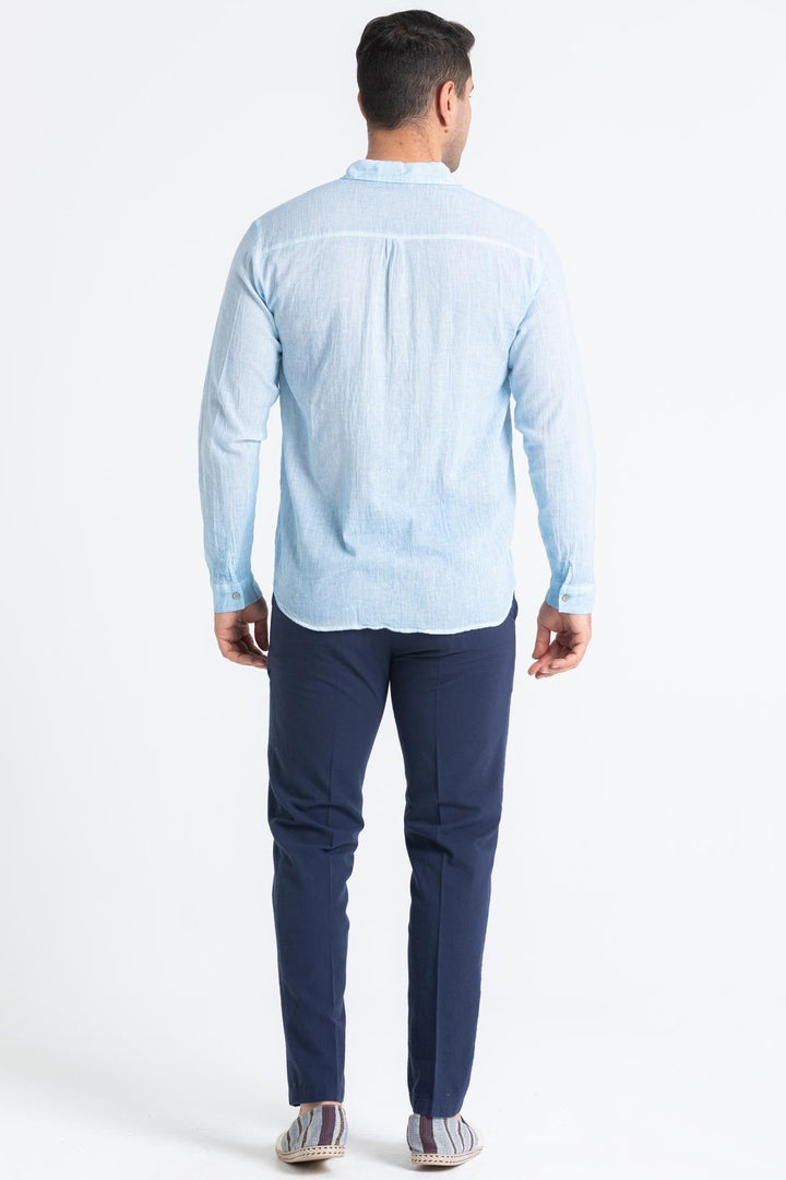 Back view of lightweight blue shirt featuring relaxed fit, long sleeves, and yoke detail